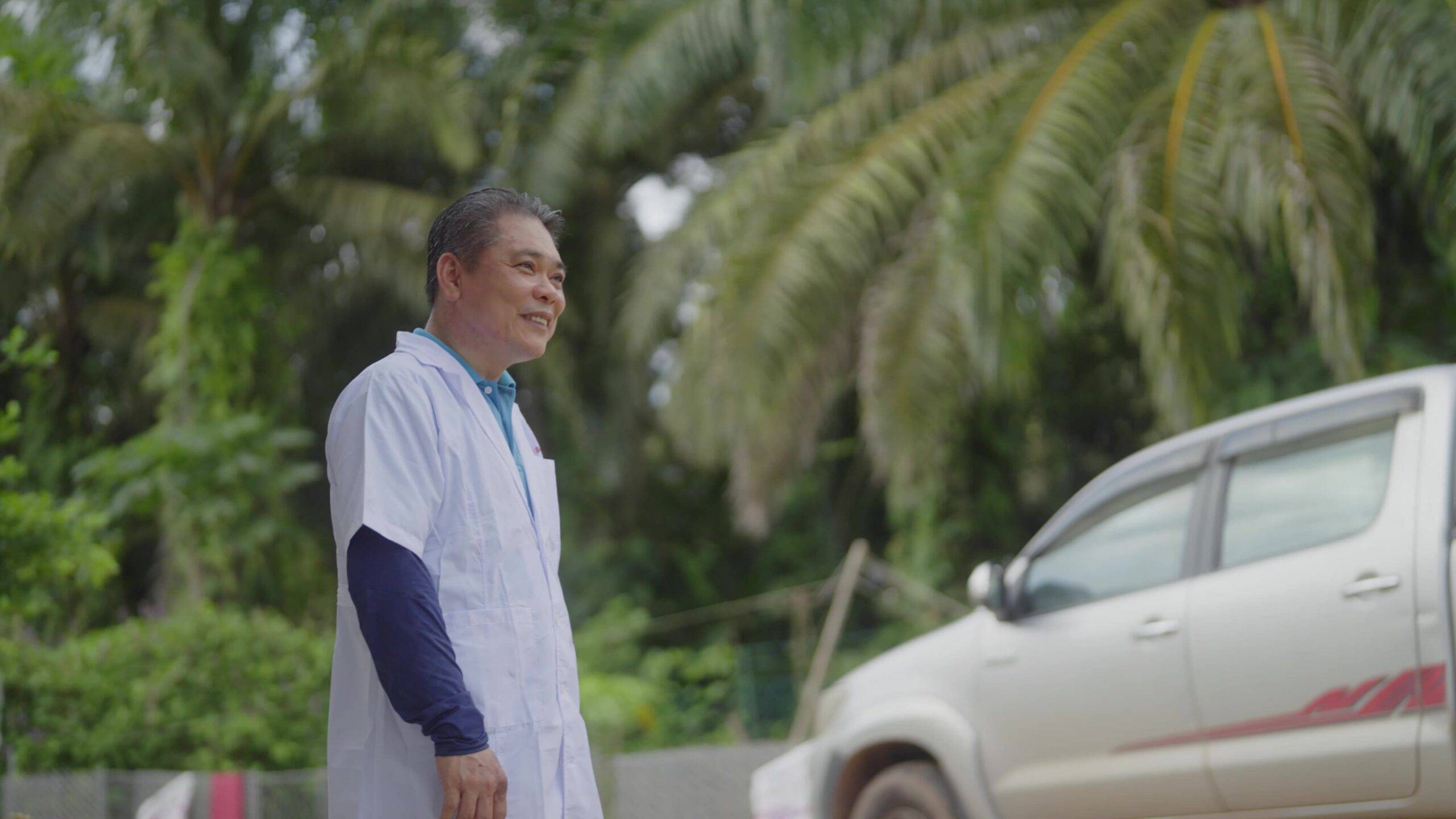 a man standing next to a car